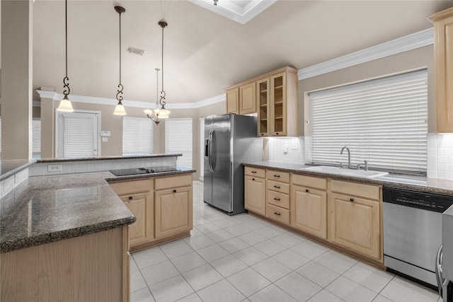 2215 Bay Haven Way, League City, TX 77573 - kitchen featuring light brown cabinetry, stainless steel appliances, a sink, tasteful backsplash, and ornamental molding