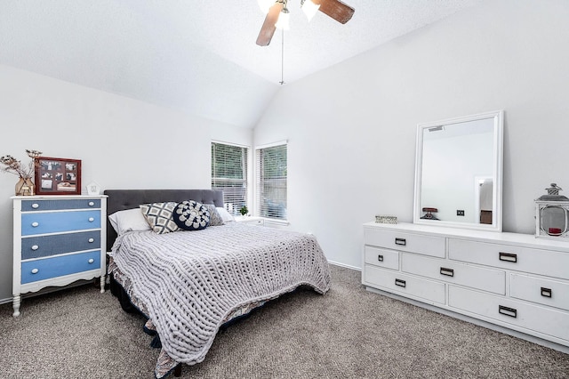 bedroom featuring dark carpet, a ceiling fan, and lofted ceiling