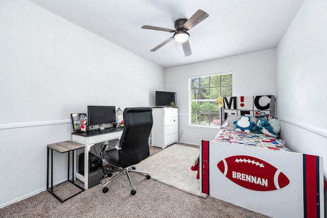 office space featuring carpet floors, baseboards, and ceiling fan