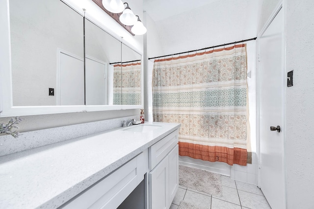 bathroom featuring a bathing tub, tile patterned floors, a shower with shower curtain, and vanity