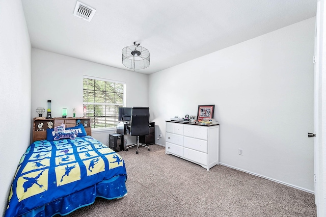 carpeted bedroom with baseboards and visible vents
