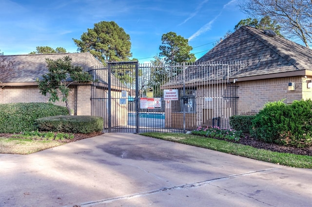 view of gate featuring fence