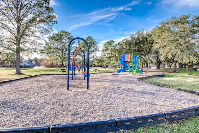 community play area with a lawn