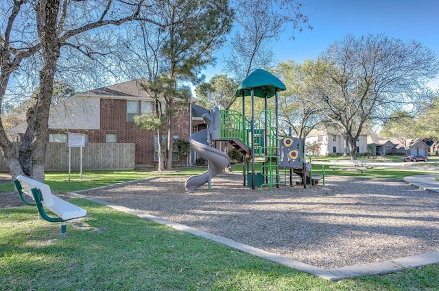 community jungle gym featuring fence