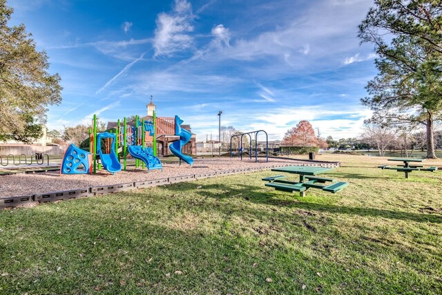 community playground featuring a yard