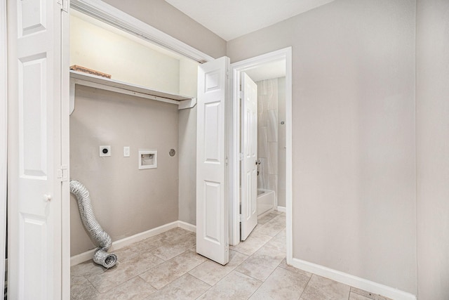 clothes washing area with laundry area, baseboards, hookup for a washing machine, electric dryer hookup, and light tile patterned floors