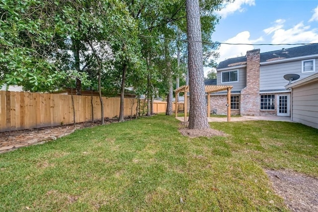 view of yard with a pergola and a fenced backyard