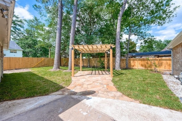 view of yard with a patio, a fenced backyard, a pergola, and a carport