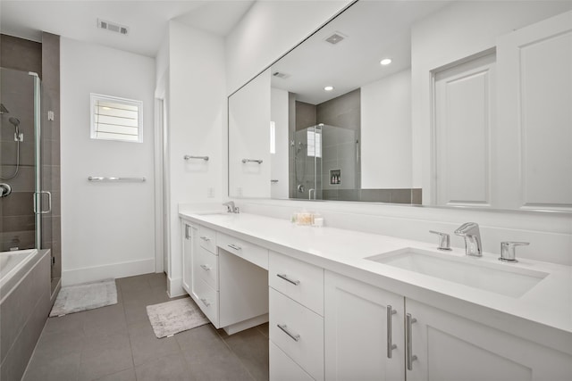 1023 Roberts St, Houston, TX 77003 - bathroom featuring a shower stall, double vanity, tile patterned floors, baseboards, and recessed lighting
