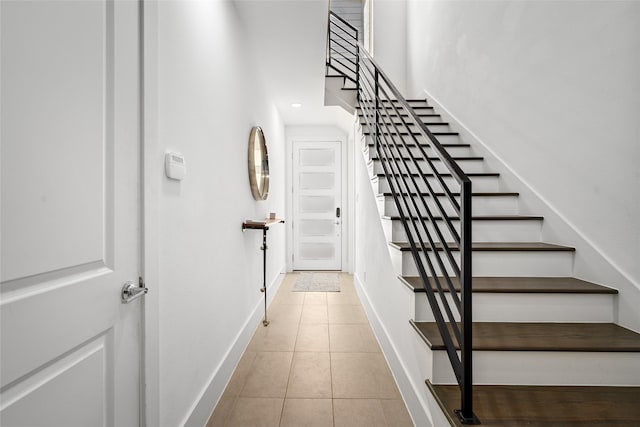 1023 Roberts St, Houston, TX 77003 - stairway with baseboards and tile patterned flooring