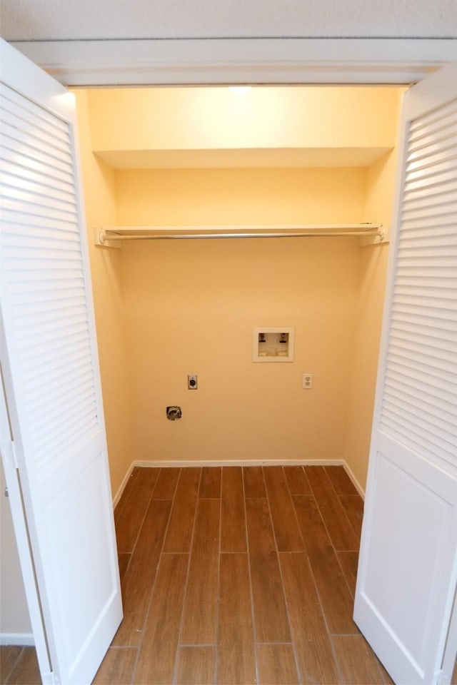 laundry room featuring washer hookup, laundry area, baseboards, electric dryer hookup, and dark wood-style floors