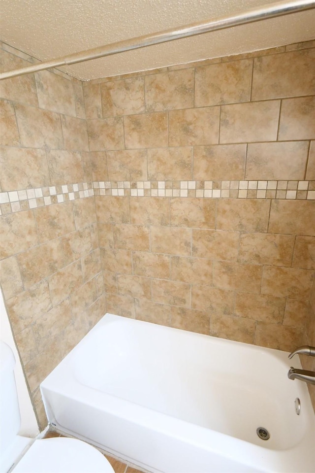 full bathroom with shower / bath combination and toilet