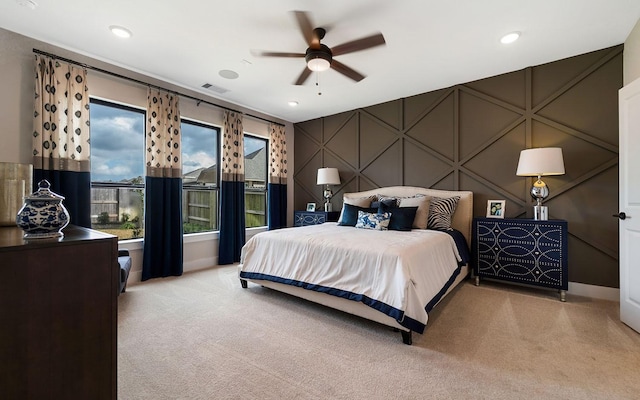 bedroom with visible vents, recessed lighting, and light carpet