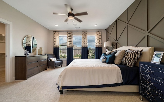 bedroom with a ceiling fan, carpet flooring, and visible vents