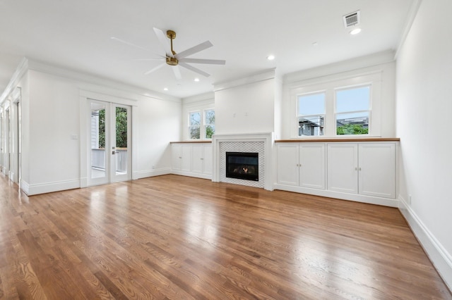 1623 Blount St, Houston, TX 77008 - unfurnished living room featuring a ceiling fan, wood finished floors, a fireplace, ornamental molding, and baseboards
