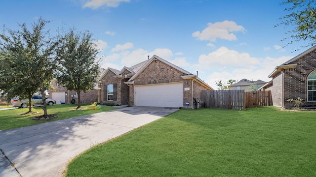 traditional-style home featuring a front yard, brick siding, fence, concrete driveway, and an attached garage
