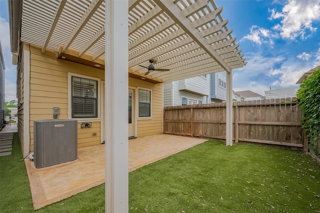 view of yard featuring central AC unit, ceiling fan, fence, and a pergola