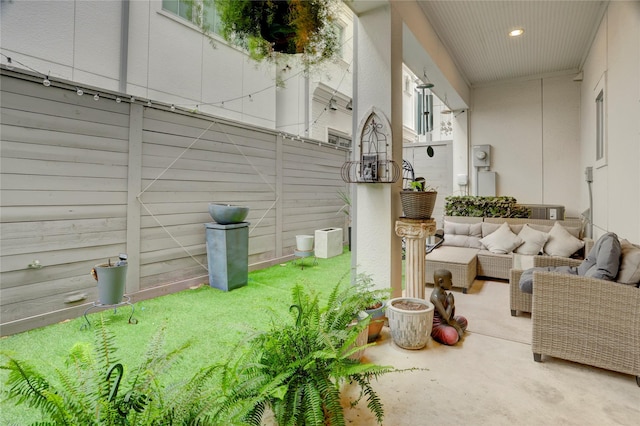 view of yard featuring fence and an outdoor hangout area