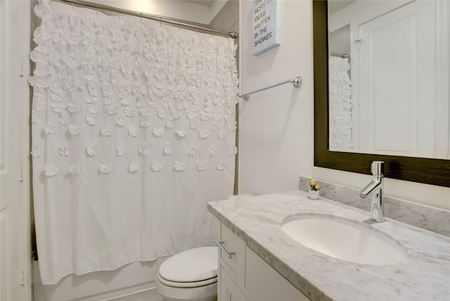 bathroom with toilet, shower / bath combination with curtain, and vanity
