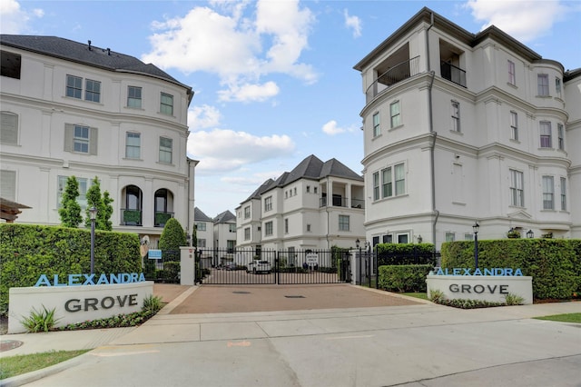 view of property with fence and a residential view