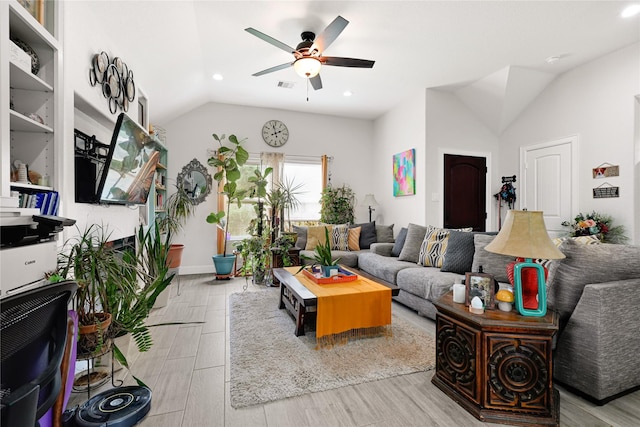 living area with ceiling fan, vaulted ceiling, wood finished floors, baseboards, and recessed lighting