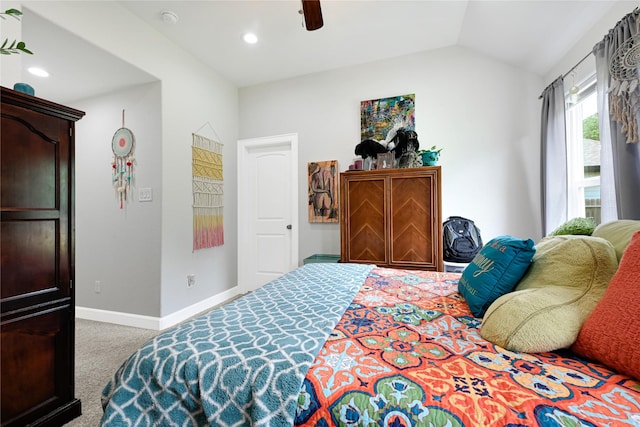 bedroom featuring carpet floors, a ceiling fan, baseboards, and lofted ceiling