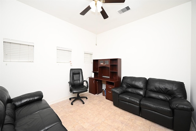 home office with light tile patterned floors, ceiling fan, and visible vents