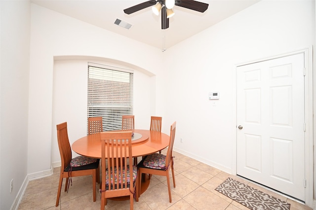 dining area featuring light tile patterned floors, ceiling fan, visible vents, and baseboards