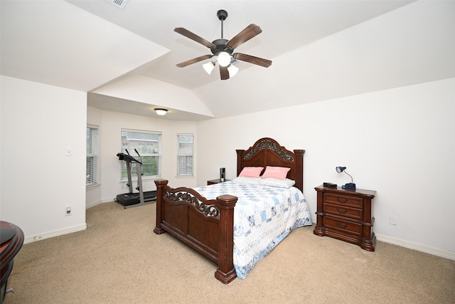 bedroom with baseboards, ceiling fan, vaulted ceiling, and light carpet