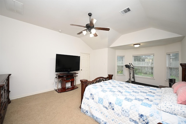 bedroom with visible vents, baseboards, vaulted ceiling, and light carpet