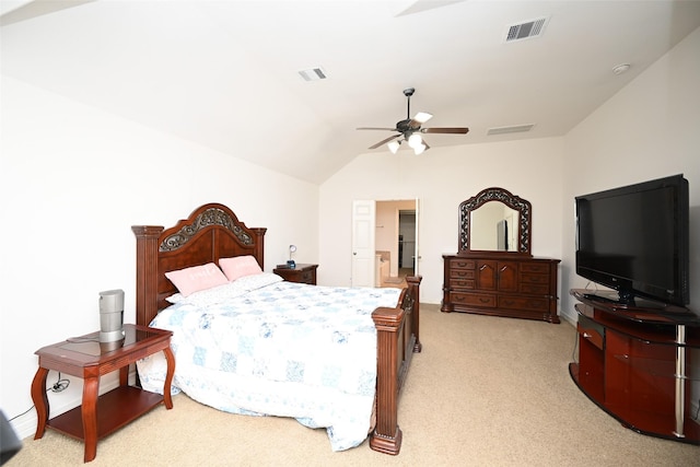 carpeted bedroom featuring ceiling fan, visible vents, and vaulted ceiling