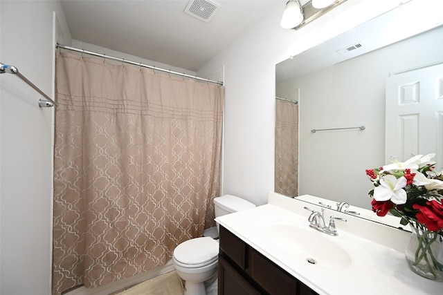 bathroom with vanity, a shower with shower curtain, toilet, and visible vents
