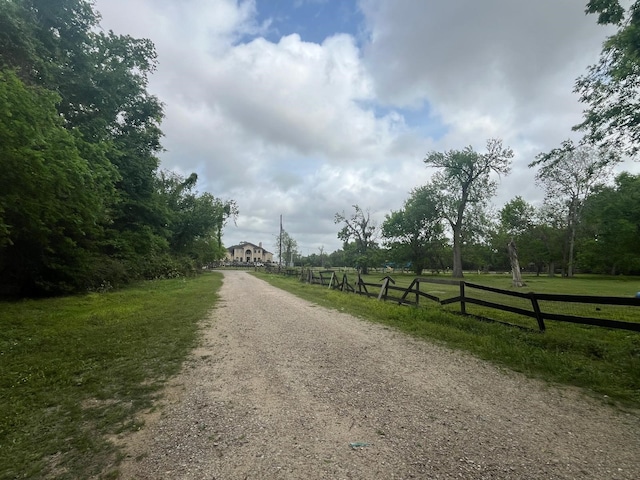 view of street with gravel driveway