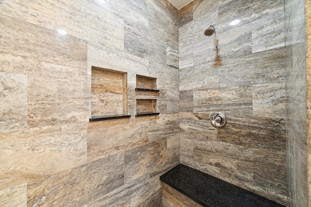 full bathroom with tiled shower