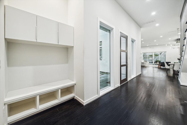 mudroom featuring recessed lighting, baseboards, dark wood-style flooring, and visible vents