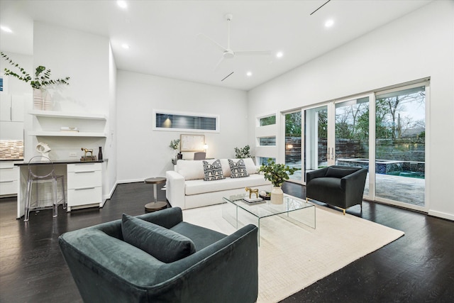 living room with baseboards, a ceiling fan, recessed lighting, and dark wood-type flooring