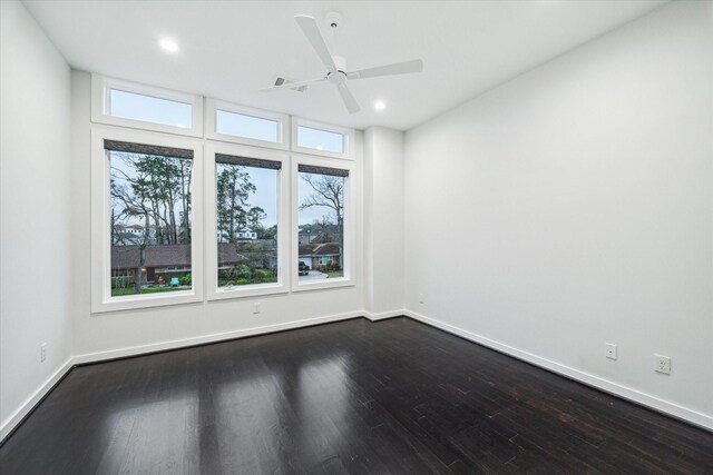 spare room featuring recessed lighting, baseboards, ceiling fan, and dark wood-style floors