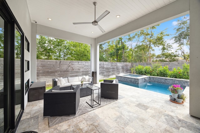 view of patio / terrace featuring a pool with connected hot tub, a ceiling fan, a fenced backyard, and an outdoor hangout area