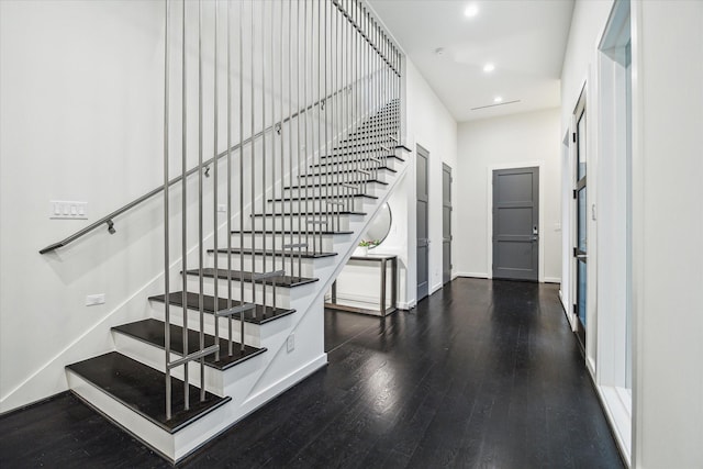 stairs featuring baseboards, recessed lighting, and wood finished floors