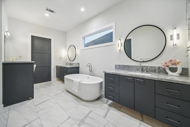 bathroom with visible vents, a sink, marble finish floor, and two vanities