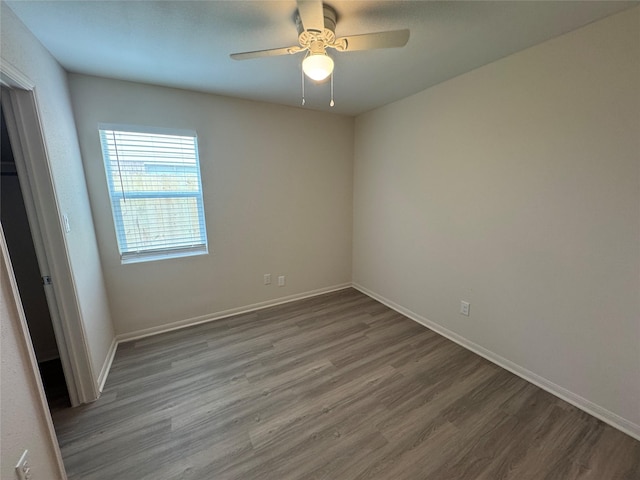 unfurnished bedroom featuring baseboards, ceiling fan, and wood finished floors