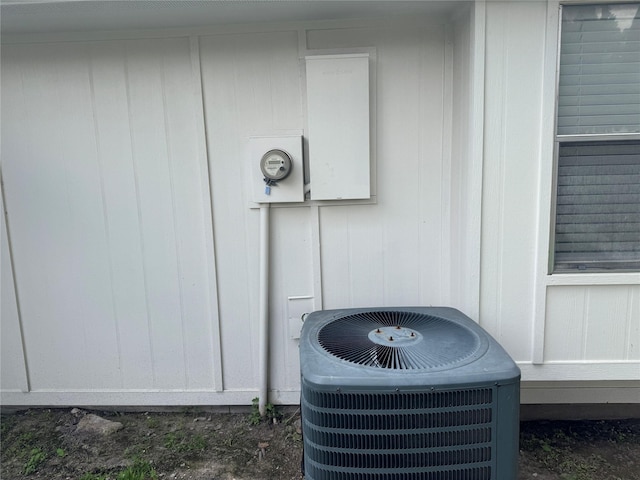 exterior details featuring central AC unit and electric meter