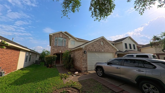 8627 Heathglen Ln, Houston, TX 77075 - view of front of house featuring an attached garage, cooling unit, a front yard, and brick siding