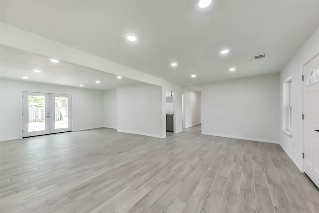 22 13th Ave N, Texas City, TX 77590 - unfurnished living room with recessed lighting, french doors, and light wood-style floors