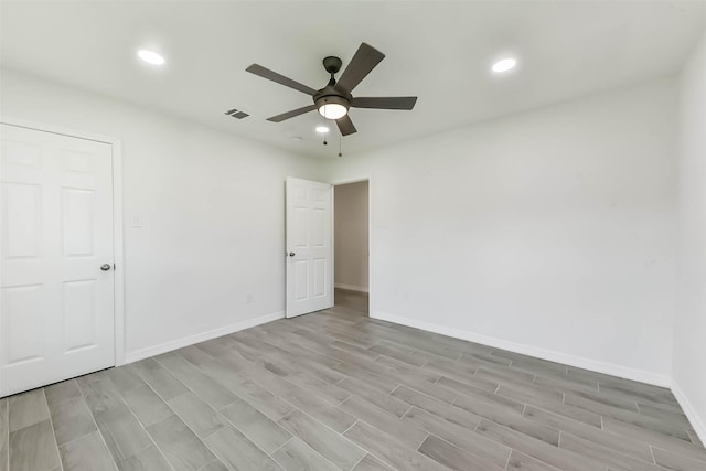 22 13th Ave N, Texas City, TX 77590 - unfurnished room featuring visible vents, baseboards, recessed lighting, a ceiling fan, and light wood-style flooring