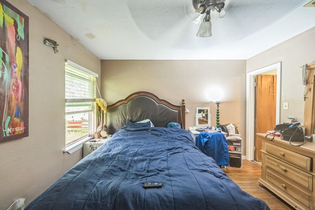 116 Chestnut St, Lake Jackson, TX 77566 - bedroom featuring a textured ceiling, ceiling fan, and wood finished floors