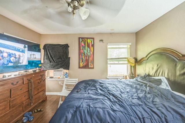 116 Chestnut St, Lake Jackson, TX 77566 - bedroom with ceiling fan, baseboards, and dark wood-type flooring