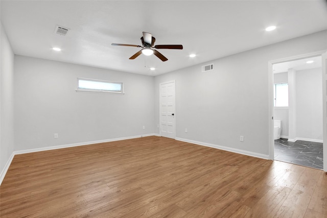 18330 Cape Bahamas Ln, Houston, TX 77058 - empty room featuring visible vents, recessed lighting, ceiling fan, and wood finished floors