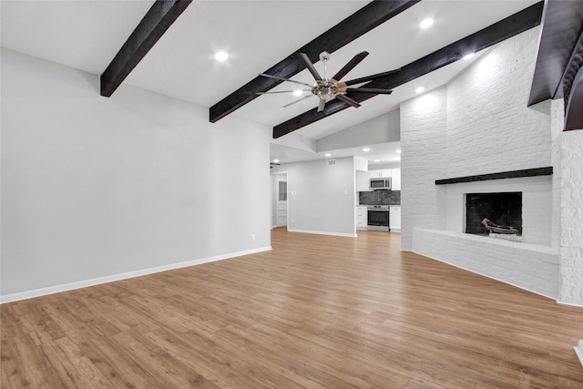 18330 Cape Bahamas Ln, Houston, TX 77058 - unfurnished living room featuring light wood-style floors, a ceiling fan, baseboards, and beam ceiling
