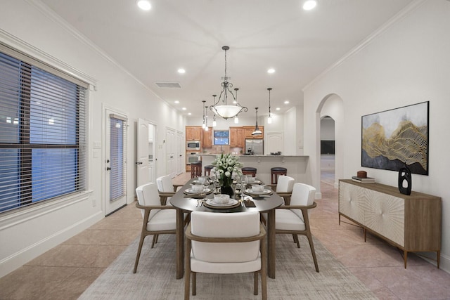 4014 N Rondelet Dr, Spring, TX 77386 - dining room featuring visible vents, arched walkways, light tile patterned floors, ornamental molding, and recessed lighting